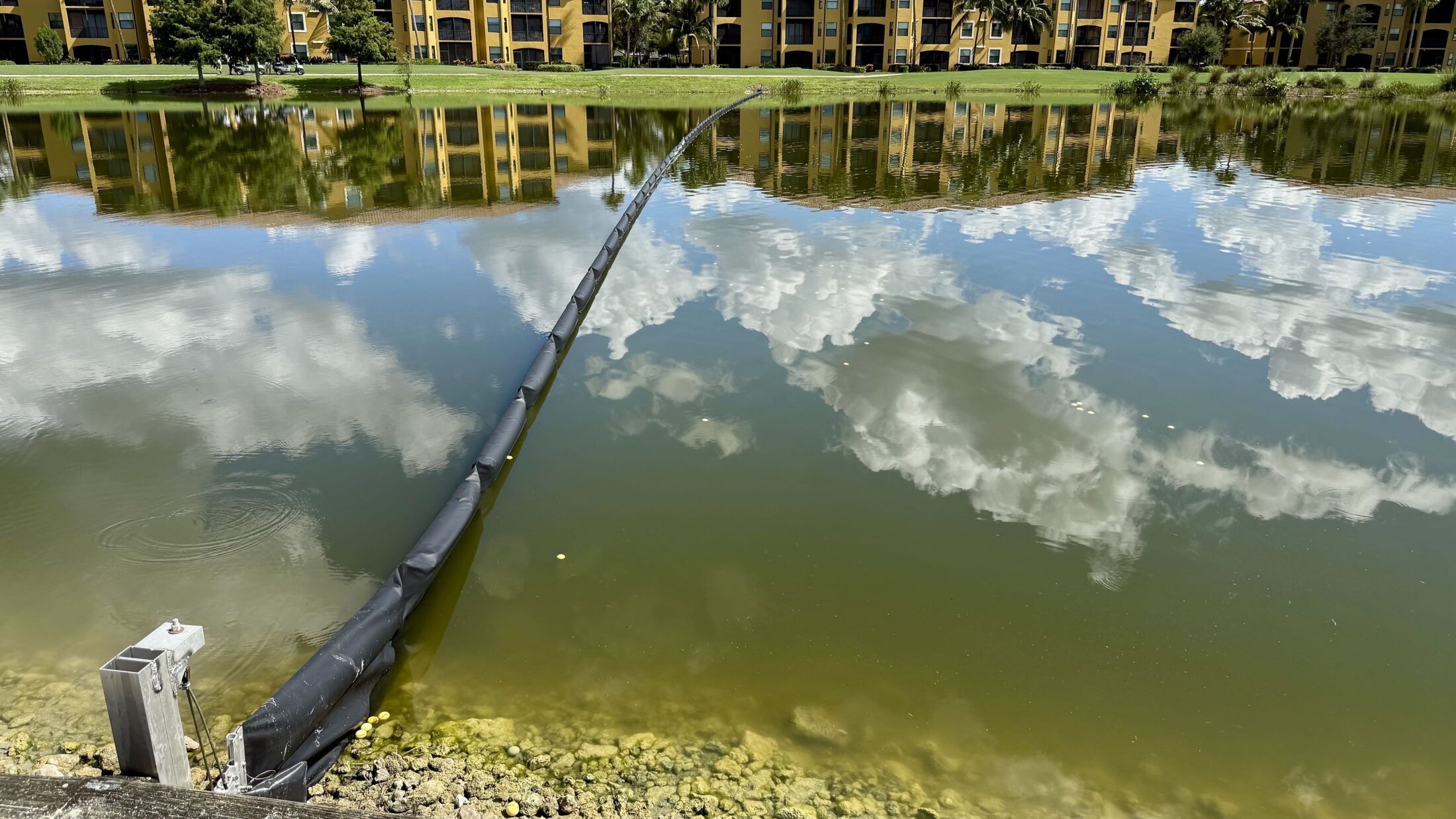 Ground view of barrier system on water