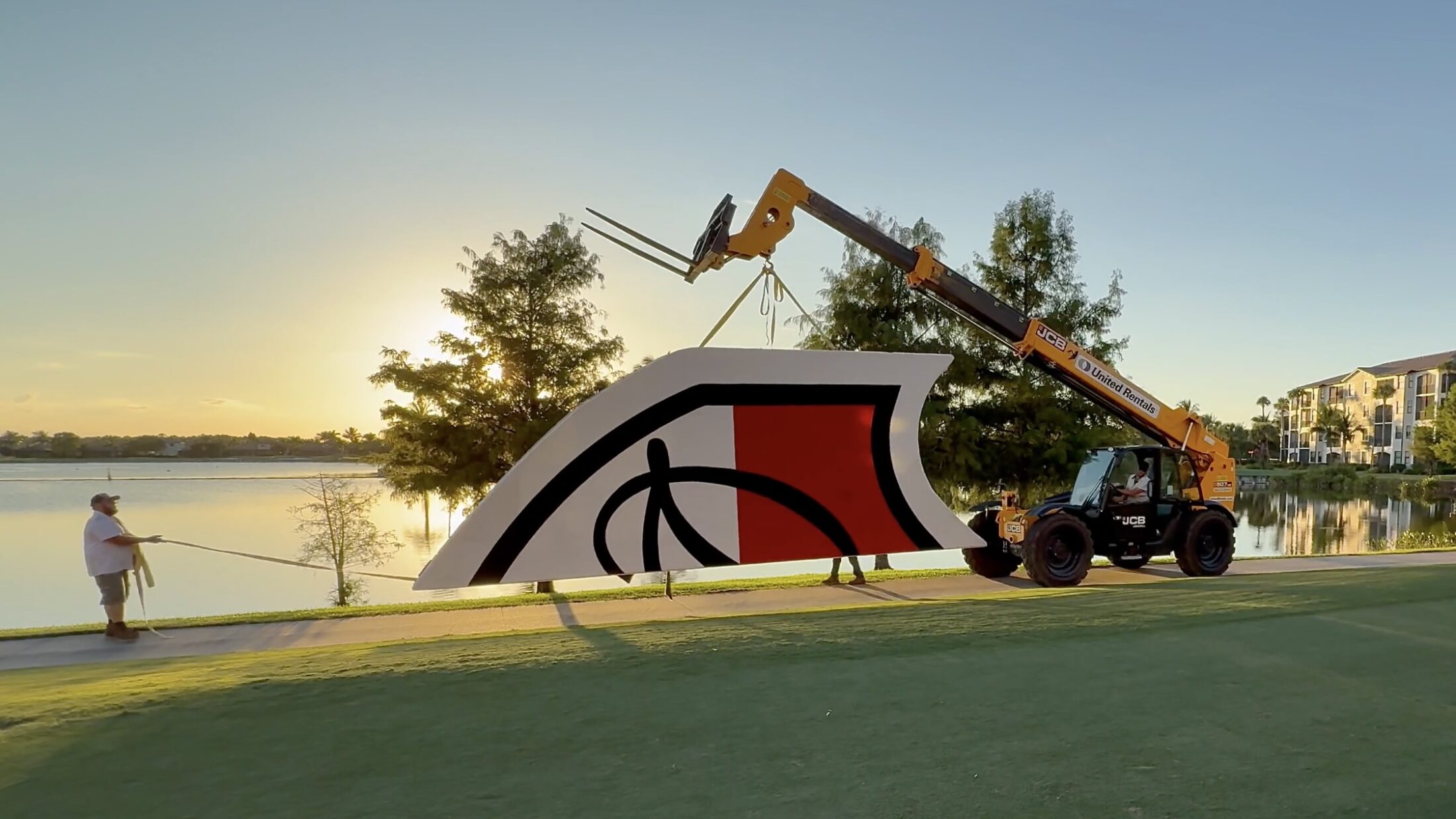Shield Logo being craned to pond